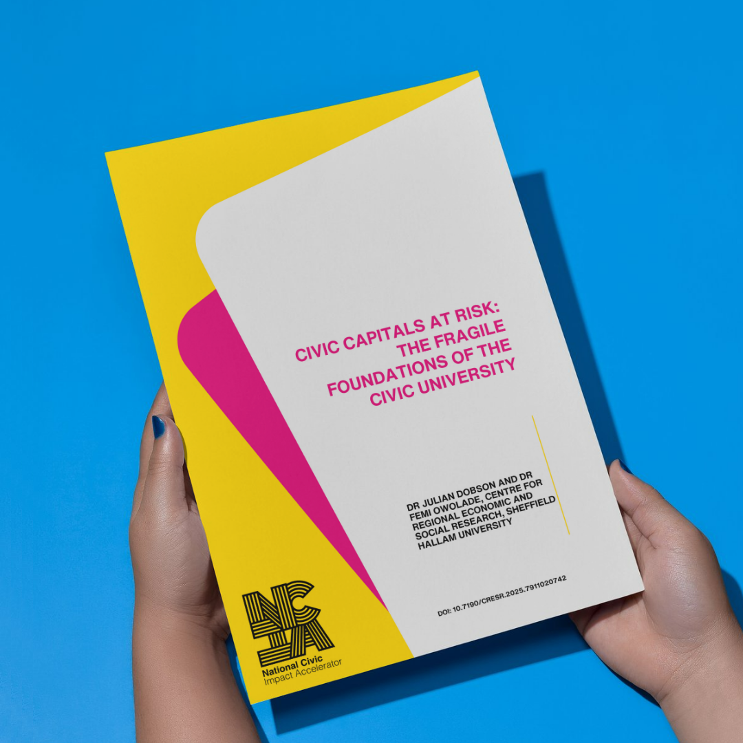 A person holds a report with a modern, colorful cover design. The report is titled "Civic Capitals at Risk: The Fragile Foundations of the Civic University" in bold pink text. The authors, Dr. Julian Dobson and Dr. Femi Ololade from the Centre for Regional Economic and Social Research at Sheffield Hallam University, are listed below the title. The bottom left corner features the National Civic Impact Accelerator (NCIA) logo in black and yellow, along with the text "National Civic Impact Accelerator." The background of the cover is primarily white, with bold yellow and magenta geometric shapes. The DOI number is printed at the bottom right. The background surface is bright blue.