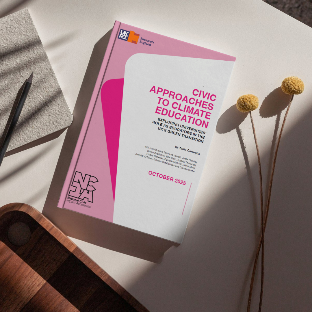 Image of NCIA report on a table next to pen and pad and dried flowers. The report is titled Civic Approaches to Climate Education by Tania Carregha