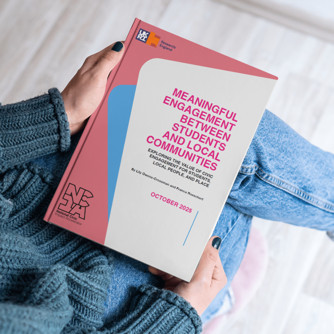 Image of a person holding an NCIA report titled "Meaningful Engagement Between Students and Local Communities" by Lily Owens-Crossman and Franca Roeschert