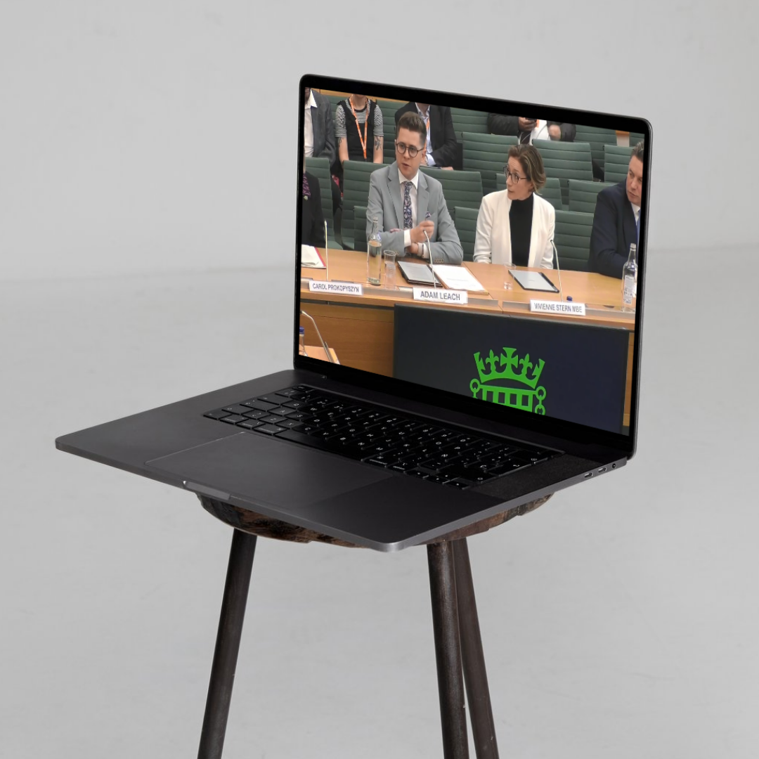 A laptop showing Adam Leach at the Education Select Committee in UK Parliament, giving evidence about civic at risk.
